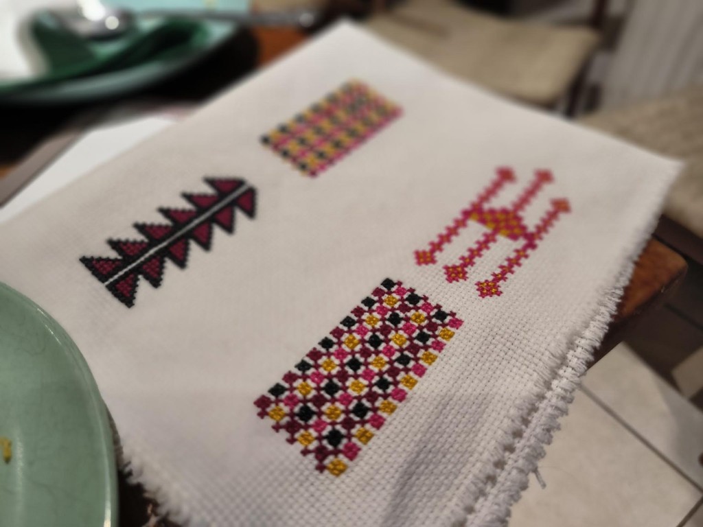 Palestinian tatreez embroidery on traditional cross-stitch fabric